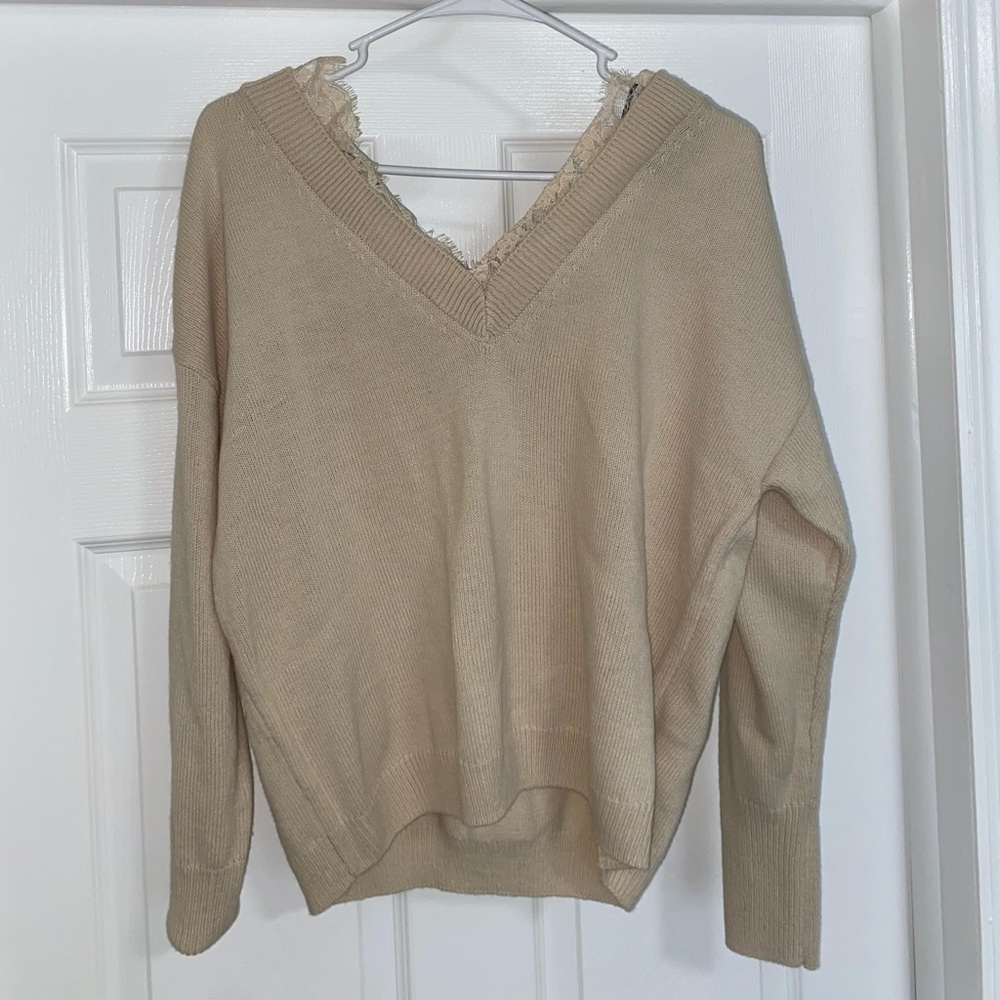 Beige sweater with lace lining around v neck